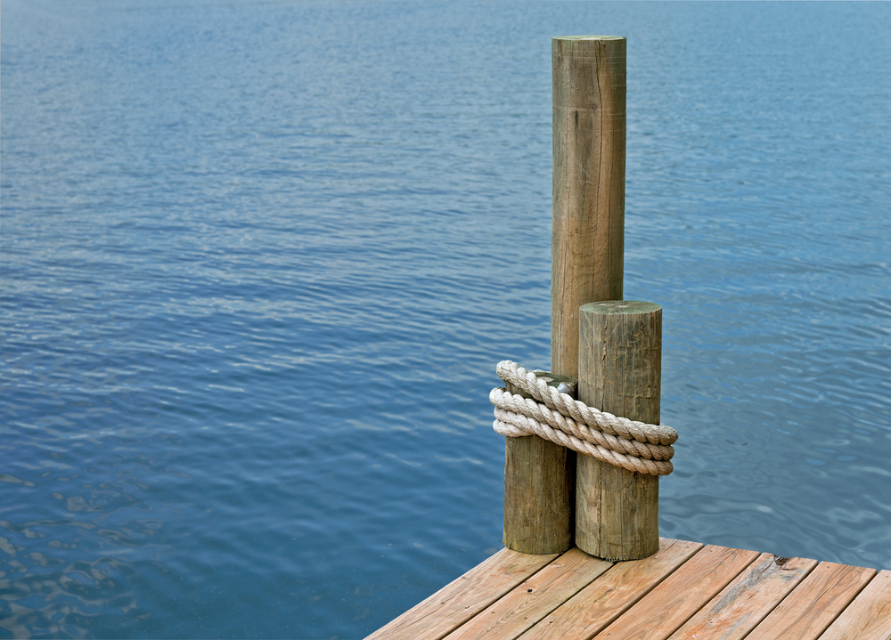 The,Corner,Of,A,Boat,Dock,,On,A,Lake,,With