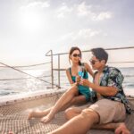 Asian,Beautiful,Couple,Drinking,Champagne,While,Having,Party,In,Yacht.