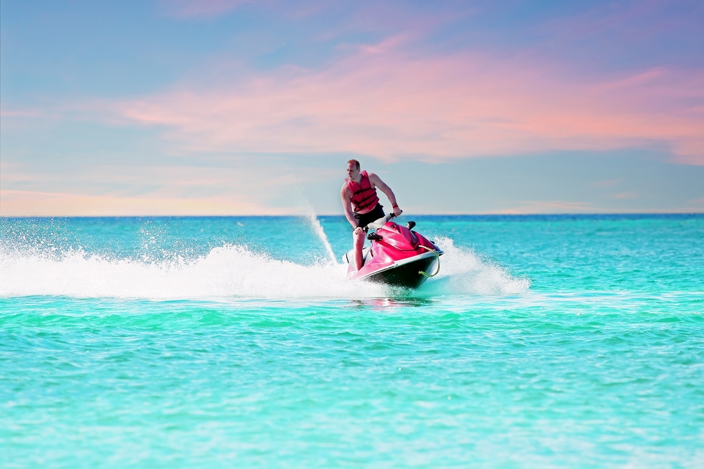 Young,Guy,Cruising,On,A,Jet,Ski,On,The,Caribbean