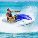 Young,Man,On,Jet,Ski,,Tropical,Ocean,,Vacation,Concept