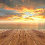 Wooden,Plank,And,Beautiful,Sunrise,In,The,Sea